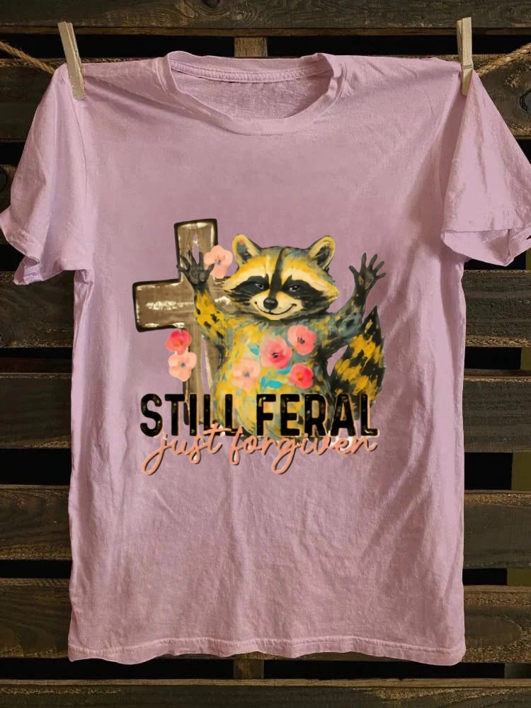 One T - shirt, one raccoon, and a fascinating story of ‘still wild, thankfully forgiven’. Just wear it!