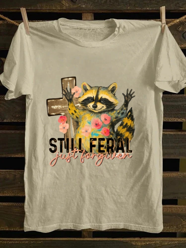 One T - shirt, one raccoon, and a fascinating story of ‘still wild, thankfully forgiven’. Just wear it!