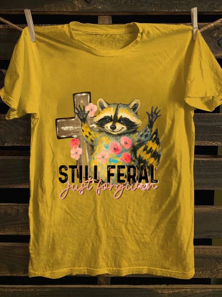 One T - shirt, one raccoon, and a fascinating story of ‘still wild, thankfully forgiven’. Just wear it!