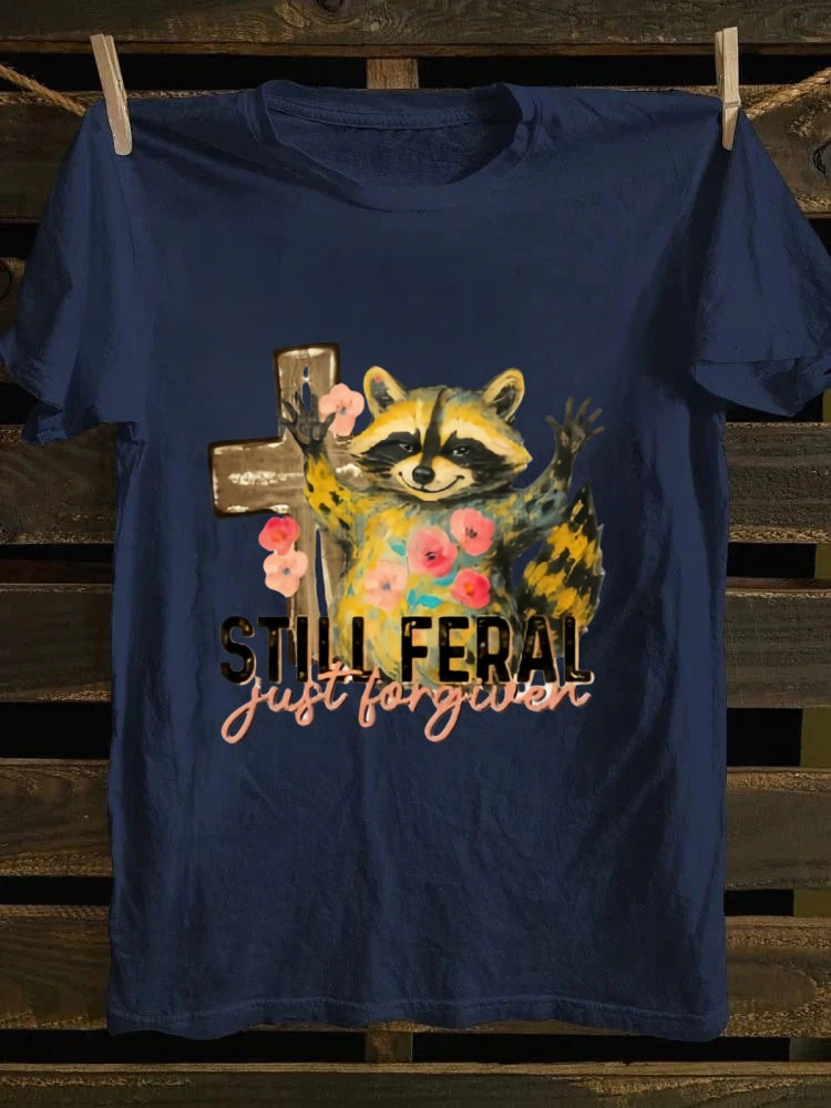 One T - shirt, one raccoon, and a fascinating story of ‘still wild, thankfully forgiven’. Just wear it!