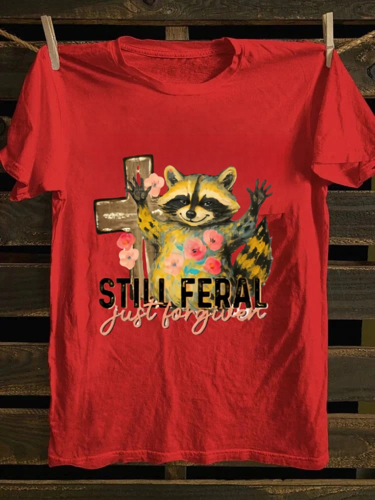 One T - shirt, one raccoon, and a fascinating story of ‘still wild, thankfully forgiven’. Just wear it!