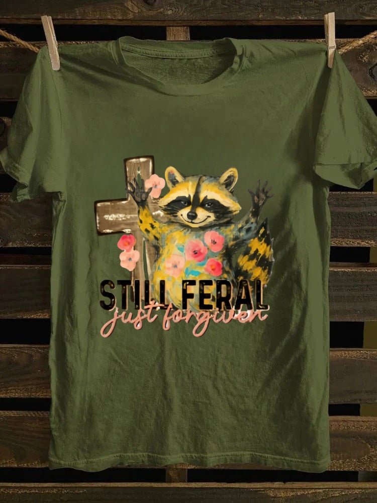One T - shirt, one raccoon, and a fascinating story of ‘still wild, thankfully forgiven’. Just wear it!