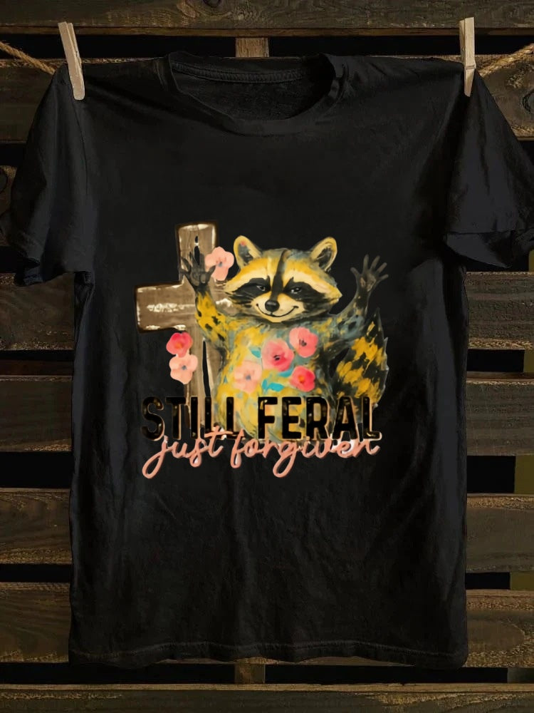 One T - shirt, one raccoon, and a fascinating story of ‘still wild, thankfully forgiven’. Just wear it!