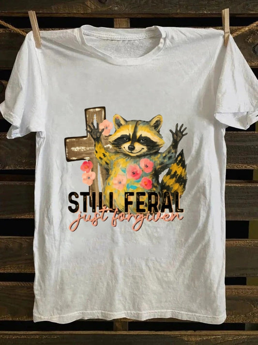 One T - shirt, one raccoon, and a fascinating story of ‘still wild, thankfully forgiven’. Just wear it!